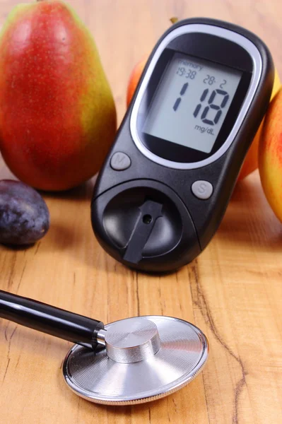 Glucose meter with medical stethoscope and fresh fruits, healthy lifestyle — Stok fotoğraf