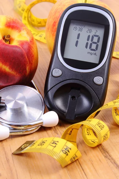 Glucose meter with medical stethoscope and fresh fruits, healthy lifestyle — Stok fotoğraf