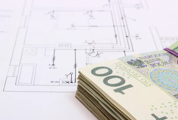 Heap of banknotes on electrical construction drawing of house — Stock Photo, Image