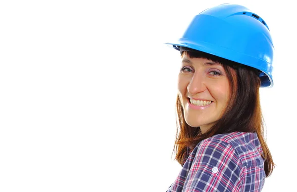 Sorrindo mulher construtor vestindo protetor capacete azul — Fotografia de Stock