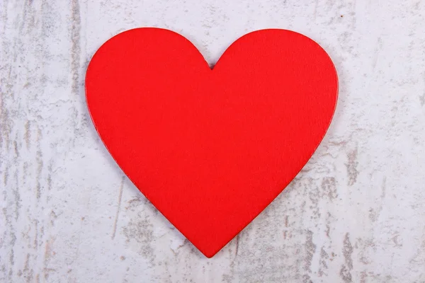 Valentine red heart on old wooden white table, symbol of love Royalty Free Stock Images