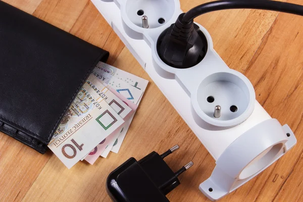 Electrical power strip with plugs and polish currency money, energy costs — Stock Photo, Image