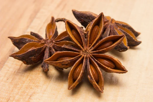 Star of anise on wooden table, seasoning for cooking — Stok fotoğraf