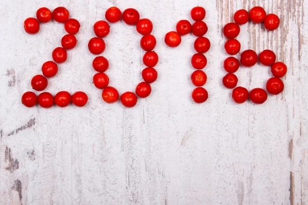 Happy new year 2016 made of red viburnum on old wooden background — Stock Photo, Image
