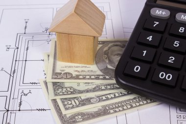 Ev ahşap bloklar ve para birimlerinin dolar çizim, ev kavramı bina inşaat hesap makinesiyle