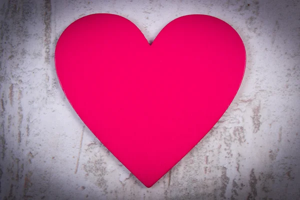 Valentine pink heart on old wooden white table, symbol of love — Stok fotoğraf