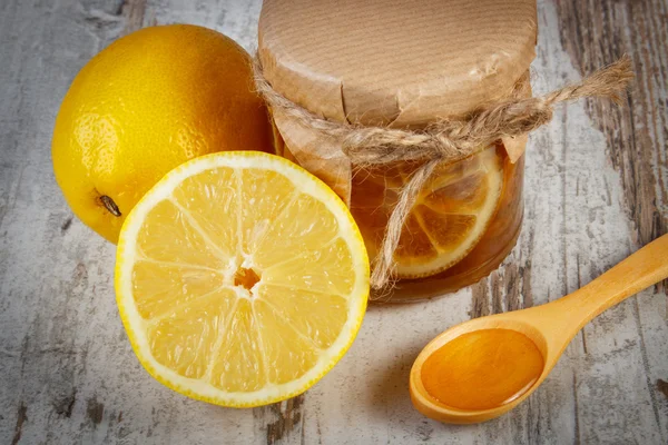 Fresh lemon and honey on wooden table, healthy nutrition — Stock Photo, Image