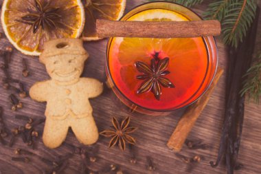Vintage photo, Mulled wine and gingerbread for christmas with spices and spruce branches