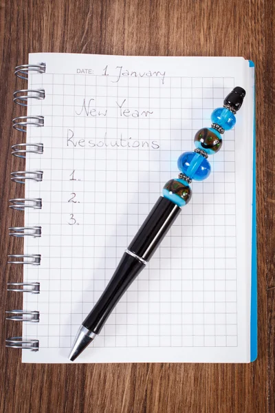 Pen and notebook for planning new years resolutions and goals — Stock Photo, Image