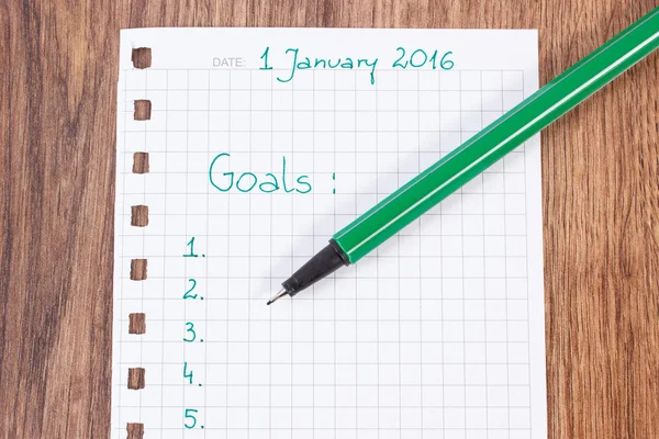 Caneta e caderno para planejamento de novos anos resoluções e metas — Fotografia de Stock