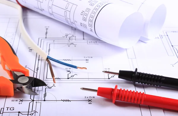 Cables of multimeter, pliers, electric wire and construction drawing — Stock Photo, Image