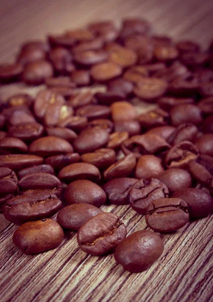 Vintage foto, mucchio di caffè su sfondo di legno — Foto Stock