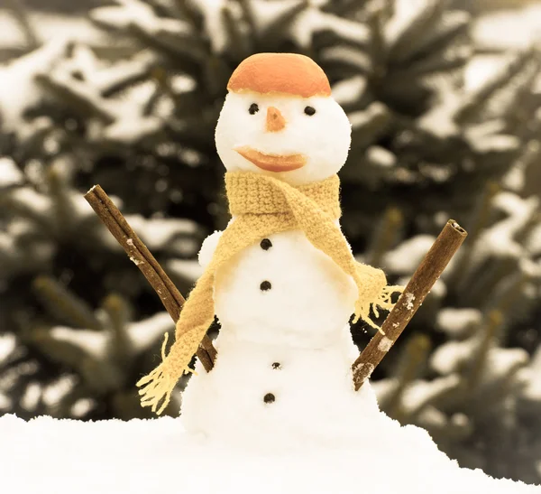Vintage photo, Snowman with woolen scarf and tangerine peel, winter season concept — Stockfoto