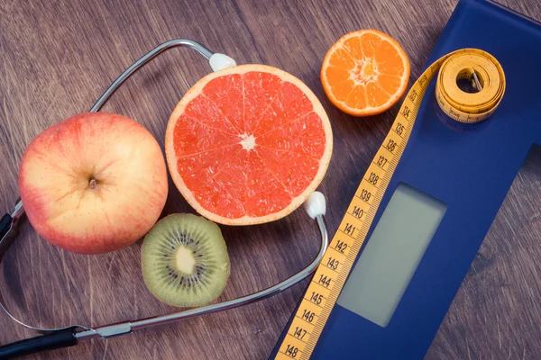 Vintage photo, Electronic bathroom scale, centimeter and fresh fruits with stethoscope, slimming and healthy lifestyles — Stock Photo, Image