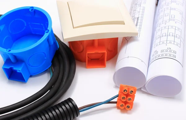 Components for electrical installations and rolls of diagrams — Stock Photo, Image