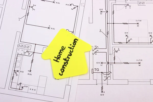 Casa de papel amarillo con texto construcción de viviendas en construcción dibujo de casa — Foto de Stock