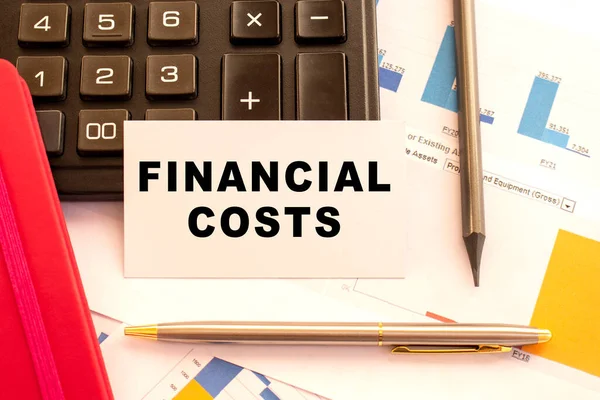 Text Financial Cost White Card Metal Pen Calculator Financial Charts — Stock Photo, Image