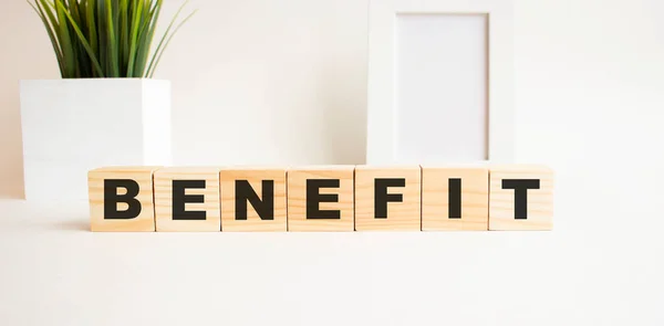 Wooden Cubes Letters White Table Word Benefit White Background Photo — Stock Photo, Image