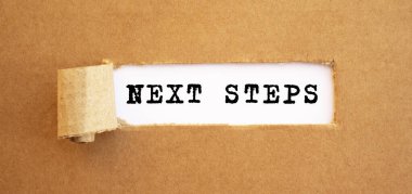Text NEXT STEPS appearing behind torn brown paper. For your design, concept. clipart