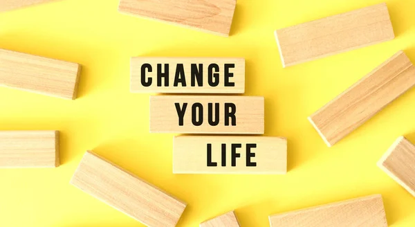 Words Change Your Life Written Scattered Wooden Blocks Yellow Background — Stock Photo, Image