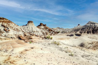 Dinosaur Provincial Park in Alberta, Canada, a UNESCO World Heritage Site noted for its striking badland topography and abundance of dinosaur fossils, one of the richest fossil locales in the world. clipart