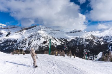 Skiing and Snowboarding at Lake Louise clipart