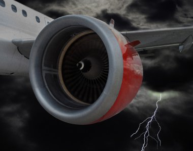 Uçak fırtınalı havada uçan kırmızı motoru ile