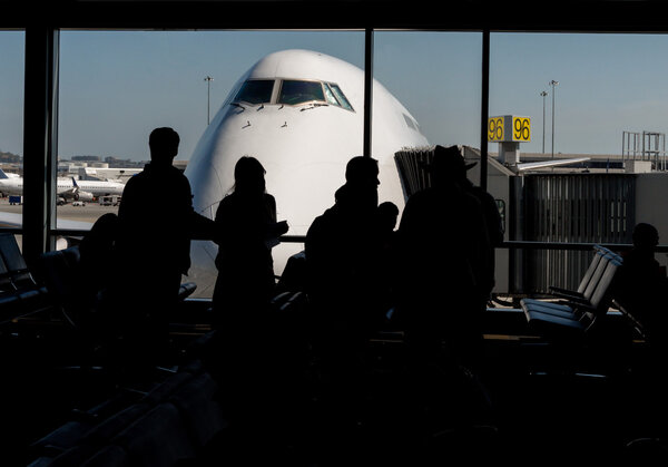 Silhouette of Passengers Waiting for Their Flight