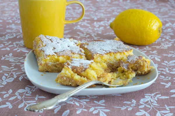 Fresh lemon bars on a plate