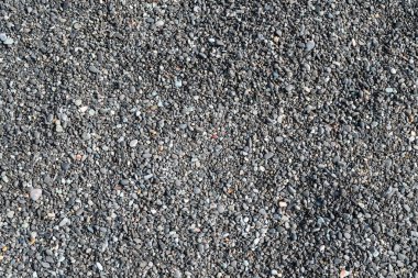 İnce gri kireçtaşı deniz çakıl taşlarının tam ekran dokusunu kapat