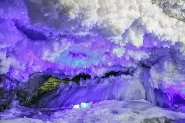 hole in the cave covered with colorful and futuristic ice structure