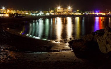 coastline with the Bay lights and buildings of the island of Crete Greece