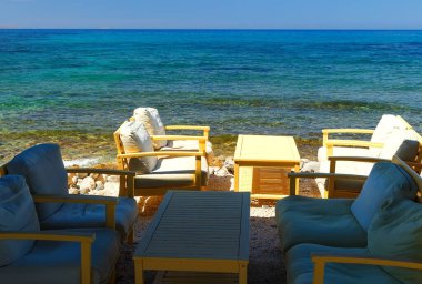 cafe tables on the coast of Georgioupolis Greece, Crete 