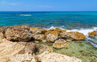 Rocks on shore of the sea near Gouves, Crete, Greece.