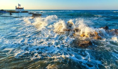 Dangerous waves crashing on rocks on the shore of Crete, Greece