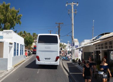 Road with car in Fira, Santorini, Europe. Sunny day
