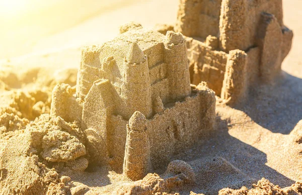 Sand castle tower. Child play and vacation concept