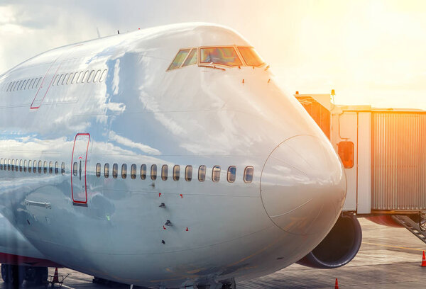 Close-up of very large wide-body airplane being prepared for towing,