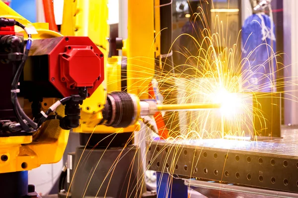 Motion Welding robots in a car factory with sparks, manufacturing, industry, factory