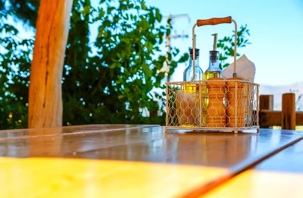 set table dining on the edge of the table against the sun sky and mountains, Greece Crete, Sunny day