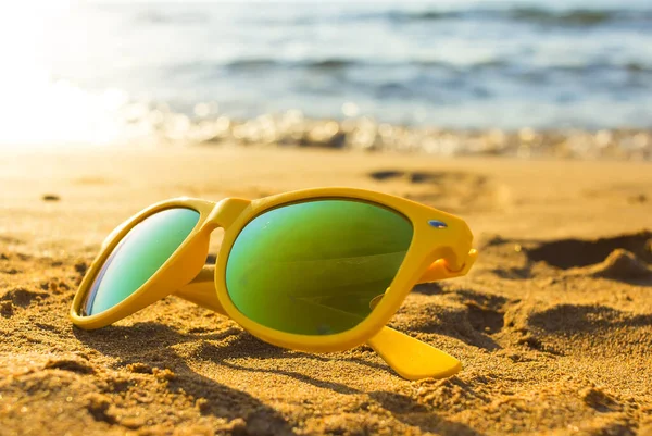 Sunglasses on the tropical beach. Travel relax vacation - azure sea, white sand, shining sun, Summer paradise day on exotic bay