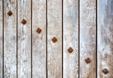 Paslı cıvatalı, ahşap arka planlı antik kapının ahşap dokusu