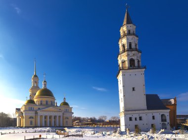inclined leaning tower and Orthodox church Nevyansk winter clipart