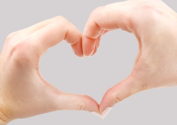 Ruce ve tvaru srdce na pozadí — Stock fotografie