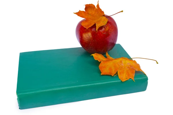 Apple with book and dry leaves — Stock Photo, Image