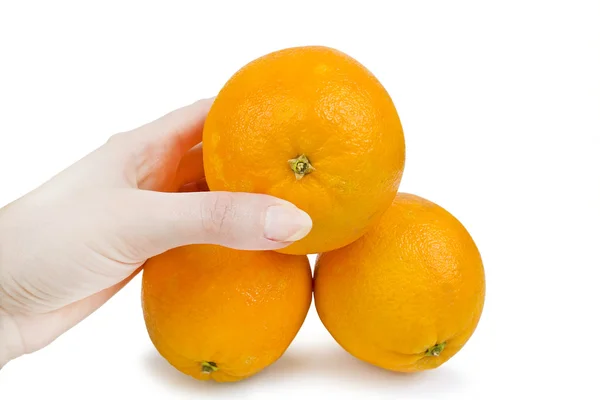 Ręka gospodarstwa trzech pomarańczy słodkiej — Zdjęcie stockowe
