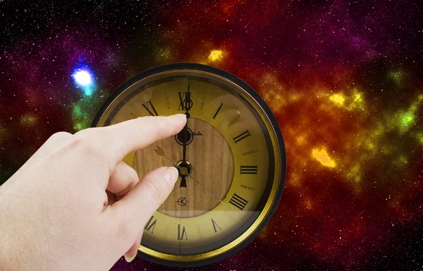 Old clock on the background of the cosmos — Stock Photo, Image
