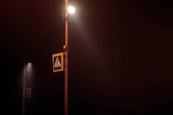 street lamp in fog in the night