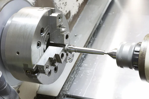 Operator machining mold and die part by CNC turning machine in f — Stock Photo, Image