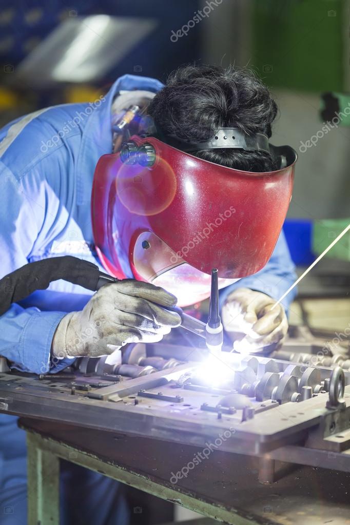 Operator repair mold by TIG welding — Stock Photo © sorapol1150 63408135